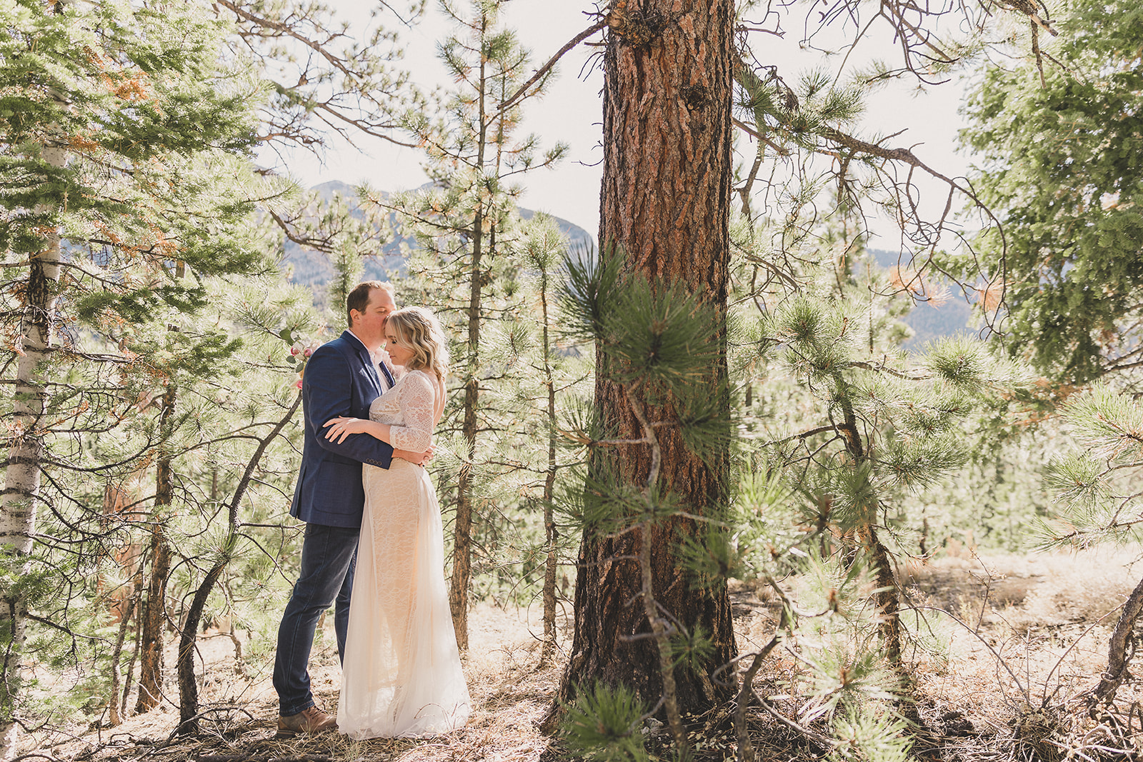 Taylor Made Photography captures bride and groom in the woods
