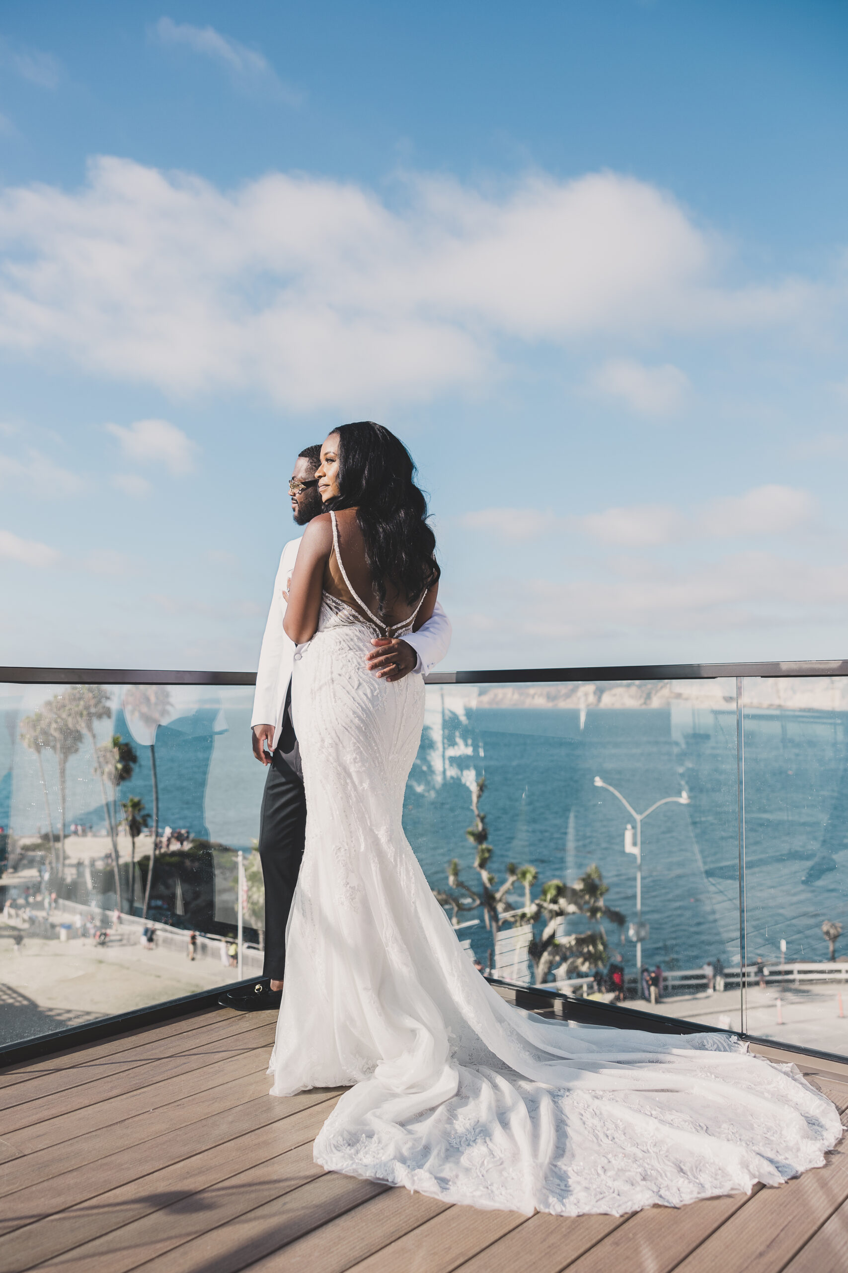 Elegant bridal portrait of AJ & Alyssa with the Pacific Ocean backdrop at La Jolla Cove Rooftop by Wedgewood Weddings